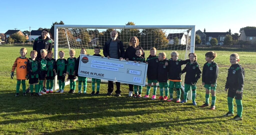 Photo of Lakenheath Youth Football accepting a grant cheque from Lakenheath Pride in Place